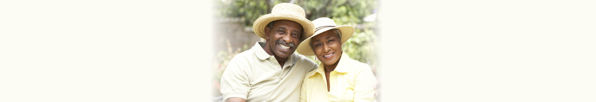 senior couple earing hat smiling